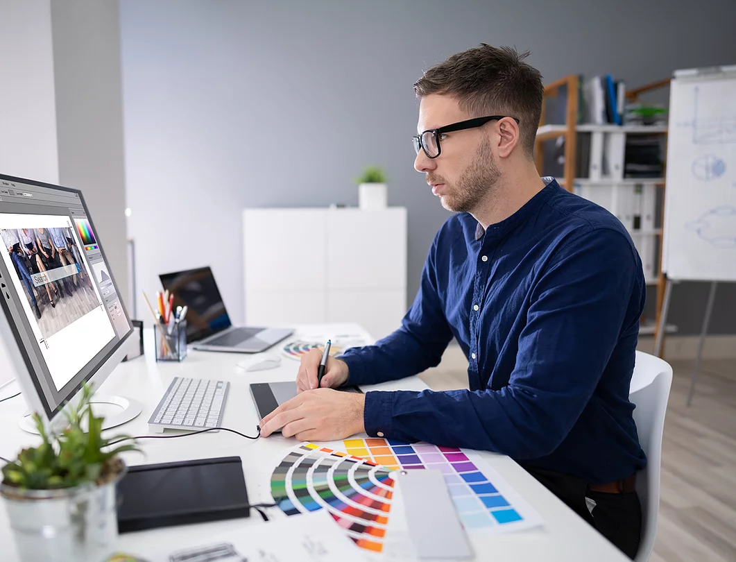 A guy in front of a computer.